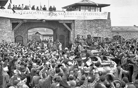 Liberation — prisoners rushing toward American soldiers at Mauthausen, May 1945